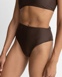 Rhythm Classic Hi Waste Pant in Chocolate brown bikini swimsuit bottoms side profile view highlighting the secure high rise waistband construction and clean leg openings, sold by Point Break Cambridge local family surf shop at 63 Duke street.