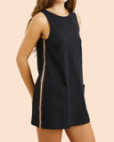 Rhythm Hanalei Mini Dress in Black side profile view highlighting the clean hemline cut and comfortable low-profile side seam construction, sold by Point Break Cambridge local family surf shop at 63 Duke street.