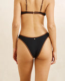 Rhythm Lily Rib Contrast Hi Cut Pant in Black bikini swimsuit bottoms back view showing the seamless rear paneling layout and medium coverage cheeky cut, sold by Point Break Cambridge local family surf shop at 63 Duke street.