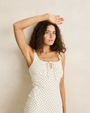 Rhythm Polka Midi Dress in Cream close up view highlighting the premium lightweight fabric texture, detailed polka dot pattern overlay, and subtle woven brand tag, sold by Point Break Cambridge local family surf shop at 63 Duke street.