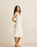 Rhythm Polka Midi Dress in Cream side profile view highlighting the clean midi length hemline and comfortable low profile side seam construction, sold by Point Break Cambridge local family surf shop at 63 Duke street.