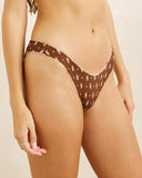 Rhythm Sandy Reversible Hi Cut Pant bikini swimsuit bottoms side profile view highlighting the comfortable high rise hip strap construction and clean leg openings, sold by Point Break Cambridge local family surf shop at 63 Duke street.