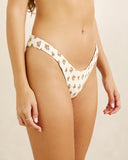 Rhythm Sandy Reversible Hi Cut Pant bikini swimsuit bottoms side profile view highlighting the comfortable high rise hip strap construction and clean leg openings, sold by Point Break Cambridge local family surf shop at 63 Duke street.