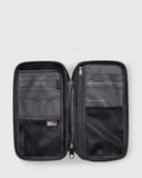 Internal view of the open Rip Curl F-Light travel wallet displaying the passport sleeves, card slots, and zip coin pocket.