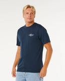 Man wearing a navy blue t-shirt with a logo on a white background