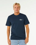 Man wearing a navy blue t-shirt with a logo on a white background