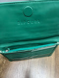 Internal open view of the green Rip Curl Plains folded wallet displaying multiple card slots and zippered compartments.