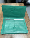 Internal open view of the green Rip Curl Plains folded wallet displaying multiple card slots and zippered compartments.
