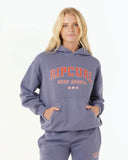 Front view of the Rip Curl Varsity Sports oversized hoodie in blue grey showing the college-style chest graphic.