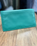 Front view of the Rip Curl Womens Plains RFID Folded wallet in light green showing the magnetic clip closure and logo.