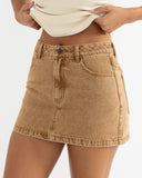 Model wearing the Rhythm Ruby Mini Skirt - Washed Sand on a white background