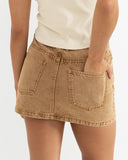 Model wearing the Rhythm Ruby Mini Skirt - Washed Sand on a white background