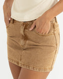 Model wearing the Rhythm Ruby Mini Skirt - Washed Sand on a white background
