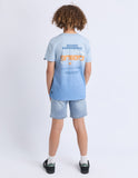 Child wearing a light blue t-shirt with text on the back, standing against a white background. Back view of the Saint Goliath Set Boys Tee in Blue showcasing the clean shoulders and straight jersey drape.