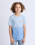 Child wearing a light blue t-shirt with a small logo on a white background. Front view of the Saint Goliath Set Boys Tee in Blue showing the classic crew neck, regular youth fit, and chest graphic print.