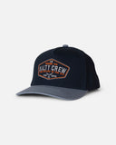 Salty Crew Tailfin Snapback Cap in Mid Blue marine tone front view showing the structured six-panel crown curved protective visor bill and clean custom tailfin marine brand logo patch layout, sold by Point Break Cambridge local family surf shop at 63 Duke street.