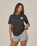 Salty Crew Womens Aloha Breeze Boyfriend Tee in Charcoal grey front view showing the comfortable relaxed short sleeve crewneck tee silhouette and small custom chest screen print logo, sold by Point Break Cambridge local family surf shop at 63 Duke street.