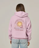 Salty Crew Womens Celestial Sun Hoodie in Pale Orchid pastel purple back view showing the bold custom celestial sun motif graphic screen print layout and relaxed straight lower hemline drape, sold by Point Break Cambridge local family surf shop at 63 Duke street.