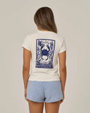 Salty Crew Womens Crabby Modern Tee in Off White cream back view showing the bold custom crab graphic motif screen print layout and relaxed straight lower hemline drape, sold by Point Break Cambridge local family surf shop at 63 Duke street.