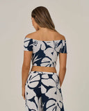Salty Crew Womens Graphic Bloom Top in Dark Navy blue back view highlighting the clean relaxed drape comfortable shoulder alignment and straight casual lower hemline architecture, sold by Point Break Cambridge local family surf shop at 63 Duke street.