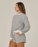 Salty Crew Womens Leeward Crew in Light Heather grey side profile view highlighting the comfortable long sleeve length rise clean side seam tracking lines and flexible active raglan shoulder paneled architecture, sold by Point Break Cambridge local family surf shop at 63 Duke street.