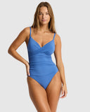 Sea Level Essentials Edit Cross Front Scoop Back One Piece swimsuit in Denim Blue front view showing the crossover design, sold by Point Break Cambridge local family surf shop at 63 Duke street.