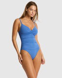 Sea Level Essentials Edit Cross Front Scoop Back One Piece swimsuit in Denim Blue side profile view showing the seamless silhouette, sold by Point Break Cambridge local family surf shop at 63 Duke street.