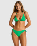 Front view of the Sea Level Essentials Edit triangle bikini top in vibrant Kelly Green showing the ribbed texture. Modeled with matching bottoms.