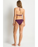 Back view of the Sea Level Essentials Edit Longline Halter Top in Claret highlighting the adjustable halter tie and secure back clasp closure.