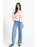 Seeking Lola Audrey Blazer in Marshmallow cream side profile view showing the long sleeves and clean side panels, sold by Point Break Cambridge local family surf shop at 63 Duke street.
