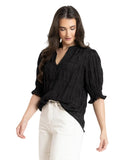 Seeking Lola Butterfly Top in Black side profile view highlighting the fluid armhole cut and wing style sleeve length, sold by Point Break Cambridge local family surf shop at 63 Duke street.