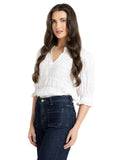 Seeking Lola Butterfly Top in White side profile view highlighting the fluid armhole cut and wing style sleeve length, sold by Point Break Cambridge local family surf shop at 63 Duke street.