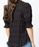 Back view of the women's Seeking Lola Carefree Butterfly blouse displaying the comfortable relaxed fit and clean shoulder drape.