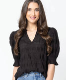 Front view of the Seeking Lola Carefree Butterfly Top in classic black showing the flattering V-neckline.