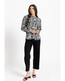 Front view of the Seeking Lola Remembered Top in Mono Whisper highlighting the high frill neckline and black and white pattern.