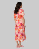 Seeking Lola Florence Dress in Strawberry Punch back view showing the elegant relaxed drape premium vibrant fabric alignment and clean structural bodice paneled tailoring with secure back zip closure, sold by Point Break Cambridge local family surf shop at 63 Duke street.
