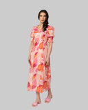 Seeking Lola Florence Dress in Strawberry Punch front view showing the elegant relaxed midi length silhouette flattering tailored V-neckline and clean casual flowing lower pink hemline profile, sold by Point Break Cambridge local family surf shop at 63 Duke street.