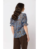 Seeking Lola Honest Top in Choc Mistique back view showing the elegant relaxed drape premium patterned fabric alignment and clean structural shoulder paneled tailoring with flatlock seam stitching, sold by Point Break Cambridge local family surf shop at 63 Duke street.