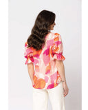 Seeking Lola Honest Top in Strawberry Punch pink back view showing the elegant relaxed drape premium vibrant fabric alignment and clean structural shoulder paneled tailoring with flatlock seam stitching, sold by Point Break Cambridge local family surf shop at 63 Duke street.