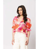 Seeking Lola Honest Top in Strawberry Punch pink side profile view highlighting the comfortable regular length torso cut clean outseam stitching paneling and functional deep fluid drape vibrant pink design lines, sold by Point Break Cambridge local family surf shop at 63 Duke street.
