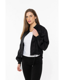 Seeking Lola Keen Jacket in Black side profile view showing the comfortable sleeve length and sleek panels, sold by Point Break Cambridge local family surf shop at 63 Duke street.
