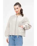 Seeking Lola Keen Jacket in Oatmeal beige side profile view showing the comfortable sleeve length and sleek panels, sold by Point Break Cambridge local family surf shop at 63 Duke street.