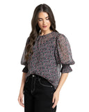 Seeking Lola Magnificent Top in Rosebud Skatter floral print blouse side profile view showing the comfortable sleeve tailoring and clean hemline, sold by Point Break Cambridge local family surf shop at 63 Duke street.