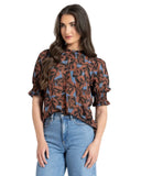 Seeking Lola SS Movement Blouse in Peacan Smudge brown abstract print close up view highlighting the premium lightweight fabric texture and pattern details, sold by Point Break Cambridge local family surf shop at 63 Duke street.