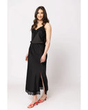 Seeking Lola Viva Skirt in Black side profile view highlighting the comfortable mid rise height clean outseam stitching paneling and functional deep fluid drape stealth black silhouette lines, sold by Point Break Cambridge local family surf shop at 63 Duke street.
