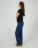 Side profile of the Silent Theory Women's Regular Tee in Black detailing the relaxed short sleeve length and neat side seams.