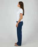 Side profile of the Silent Theory Women's Regular Tee in White detailing the relaxed short sleeve length and neat side seams.