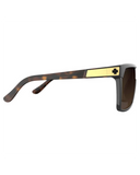 Spy Flynn Sunglasses in Honey Tort with Happy Dark Brown Fade lenses front view showcasing the oversized retro-inspired shield silhouette seamless brown gradient mono-lens distinctive honey tortoiseshell frame detailing and signature Spy Optic styling, sold by Point Break Cambridge local family surf shop at 63 Duke Street.