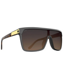 Spy Flynn Sunglasses in Honey Tort with Happy Dark Brown Fade lenses front view showcasing the oversized retro-inspired shield silhouette seamless brown gradient mono-lens distinctive honey tortoiseshell frame detailing and signature Spy Optic styling, sold by Point Break Cambridge local family surf shop at 63 Duke Street.