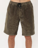 T&C Ninetees Cord Short in Olive green front view showing the textured corduroy paneling fixed waist closure and classic pocket entry layout, sold by Point Break Cambridge local family surf shop at 63 Duke street.